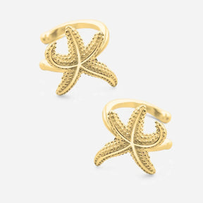 Goldene Seestern Earcuffs maritimer Schmuck auf weißem Hintergrund